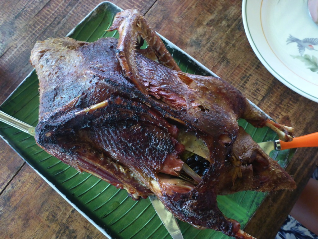 Baked duck served for our guests. The duck is stuffed with black beans and lemon grass.