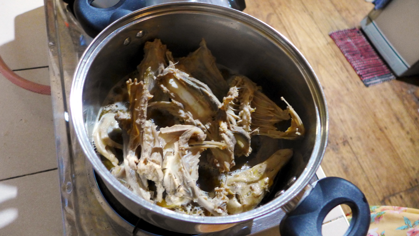 Cooking the duck bones. You need to brown these before adding water. This way you deglaze the pot with the water and get the good stuff.